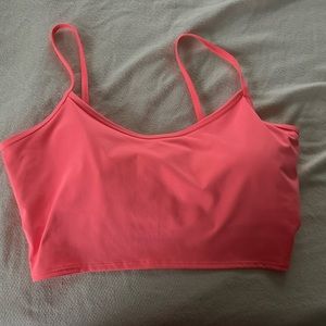Bright, neon, orange, sports bra from Victoria’s Secret pink